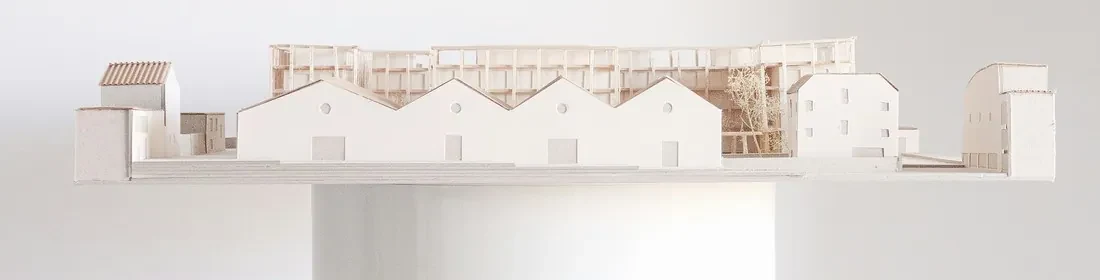 An architectural model of a small town, standing for one setting with several products working in it